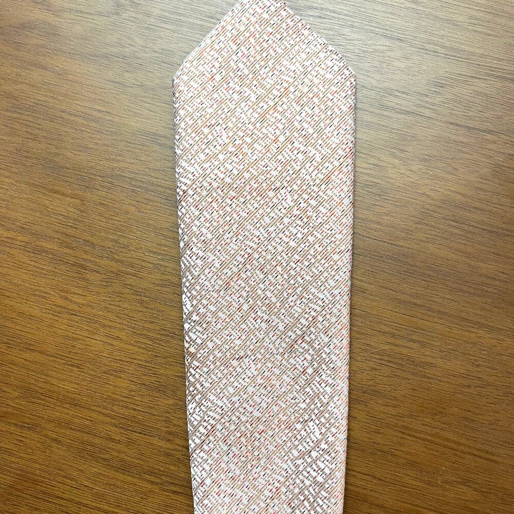 Val and Maxx silk Italian salmon colored tie with a subtle diagonal pattern